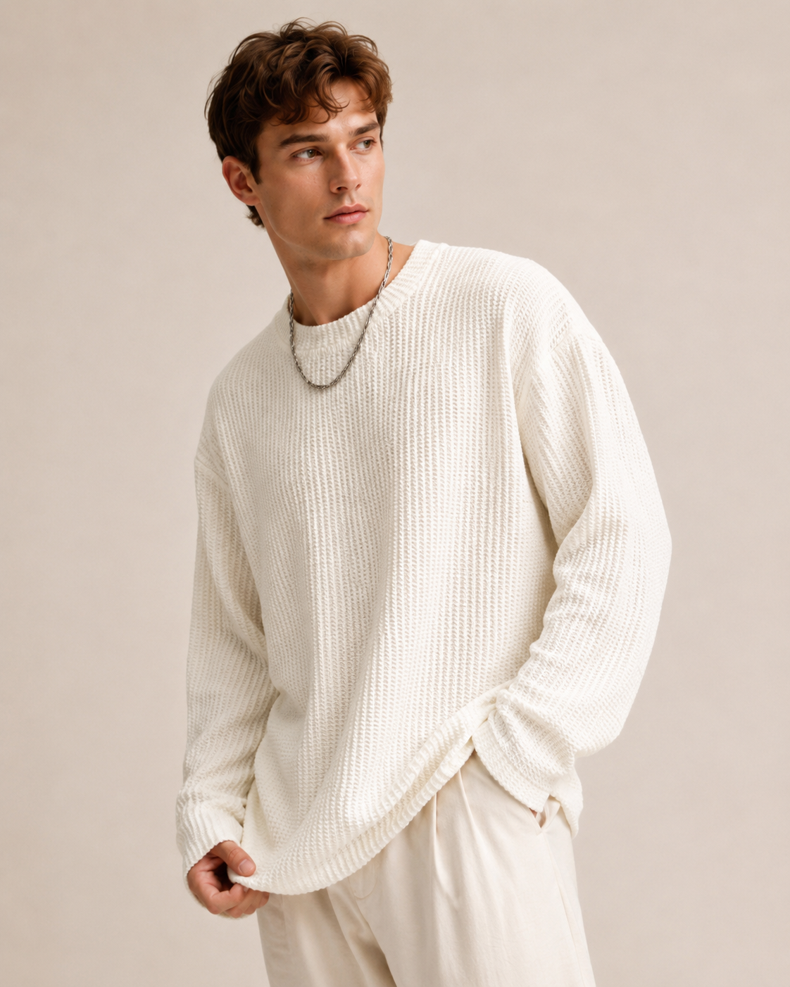 Detail view of the sweater's long sleeves and cuffs