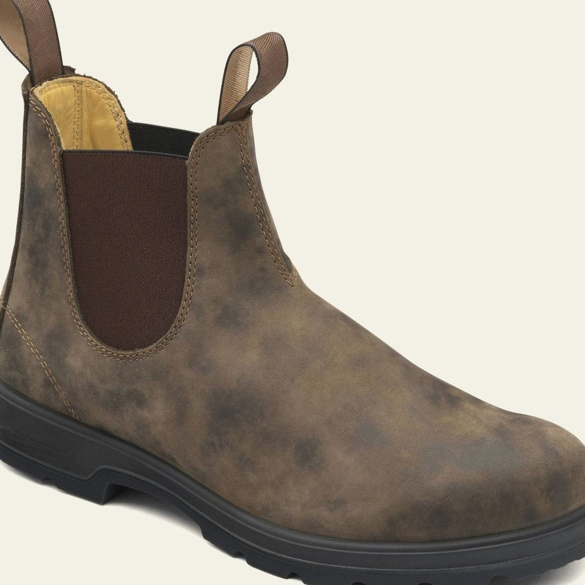 Close-up of the leather upper and pull tab on a Chelsea boot