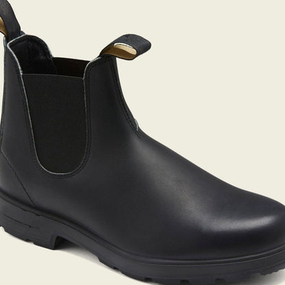 Back view of men's leather Chelsea boots with pull tabs and elastic side panels