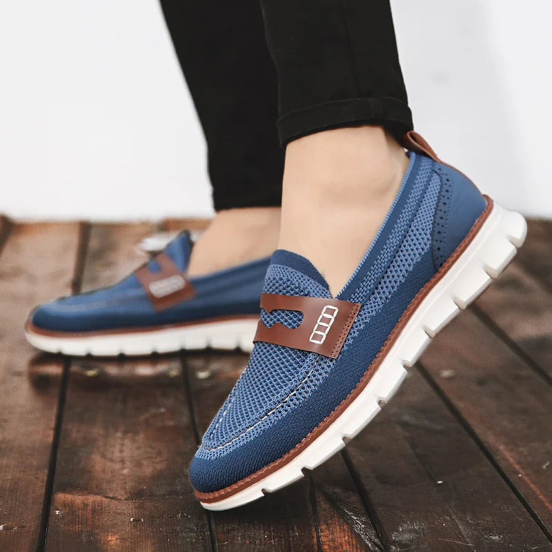 Men's penny loafers displayed at a three-quarter angle