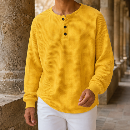 Side view of a men's textured Henley sweater