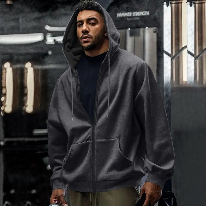 Side view of the men's hoodie highlighting its roomy silhouette