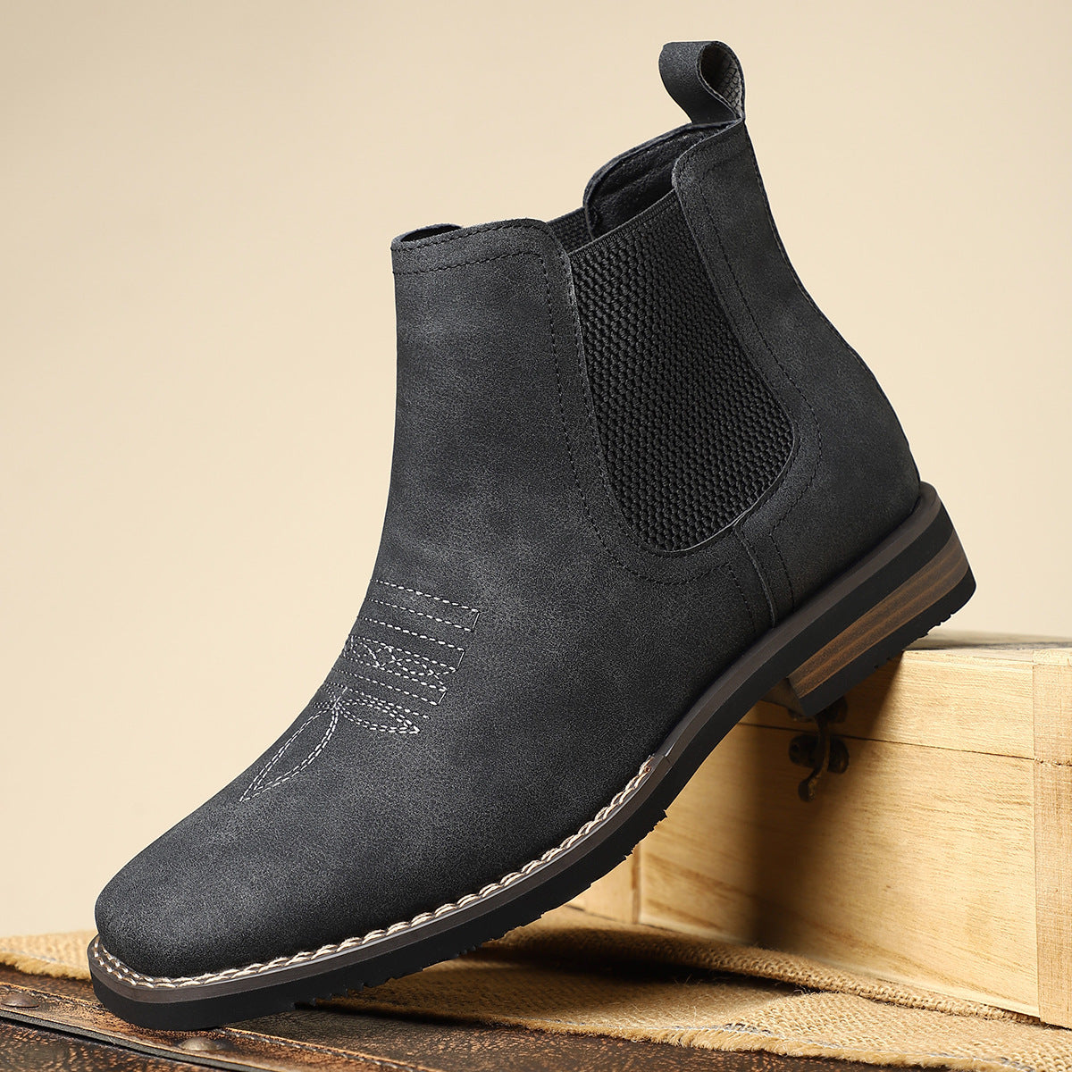Close-up view of the leather upper on men's boots