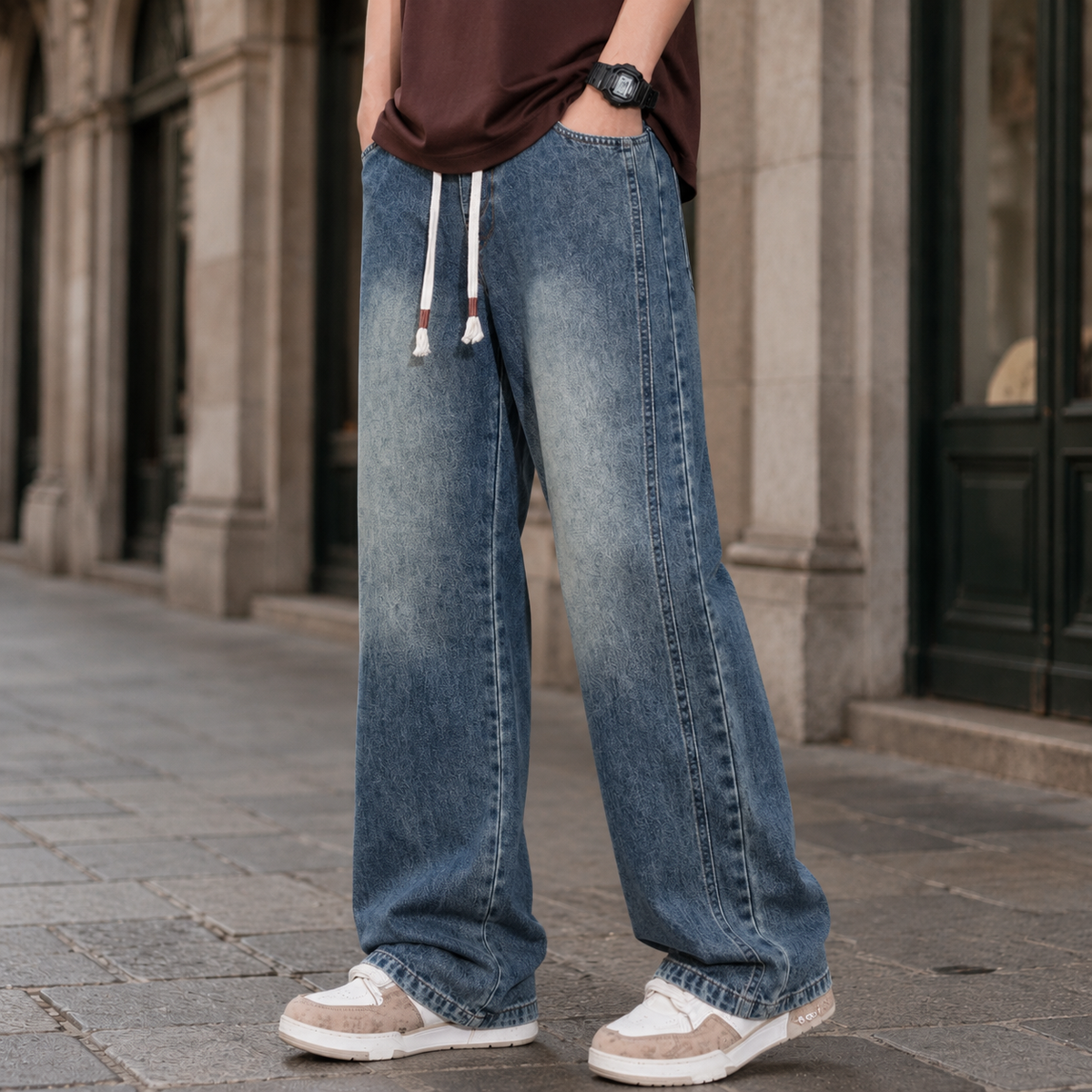 Side view of relaxed men's jeans with a wide-leg silhouette.