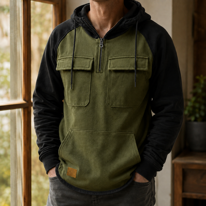 Close-up of the half-zip neckline and utility details on a gray men's hoodie