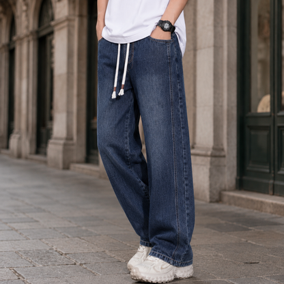 Back view of men's relaxed jeans with wide legs and casual styling.