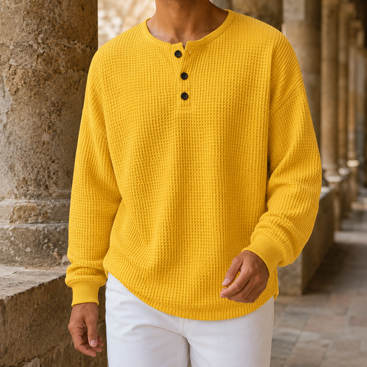 Side view of a men's textured Henley sweater