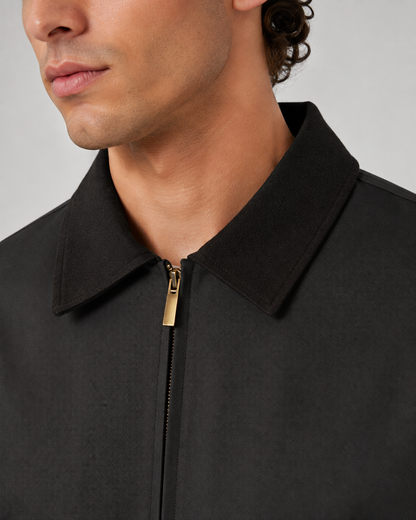 Detail view of the barn jacket's front pockets and zipper