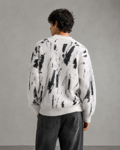 Close-up view of the sweater's fuzzy knit texture