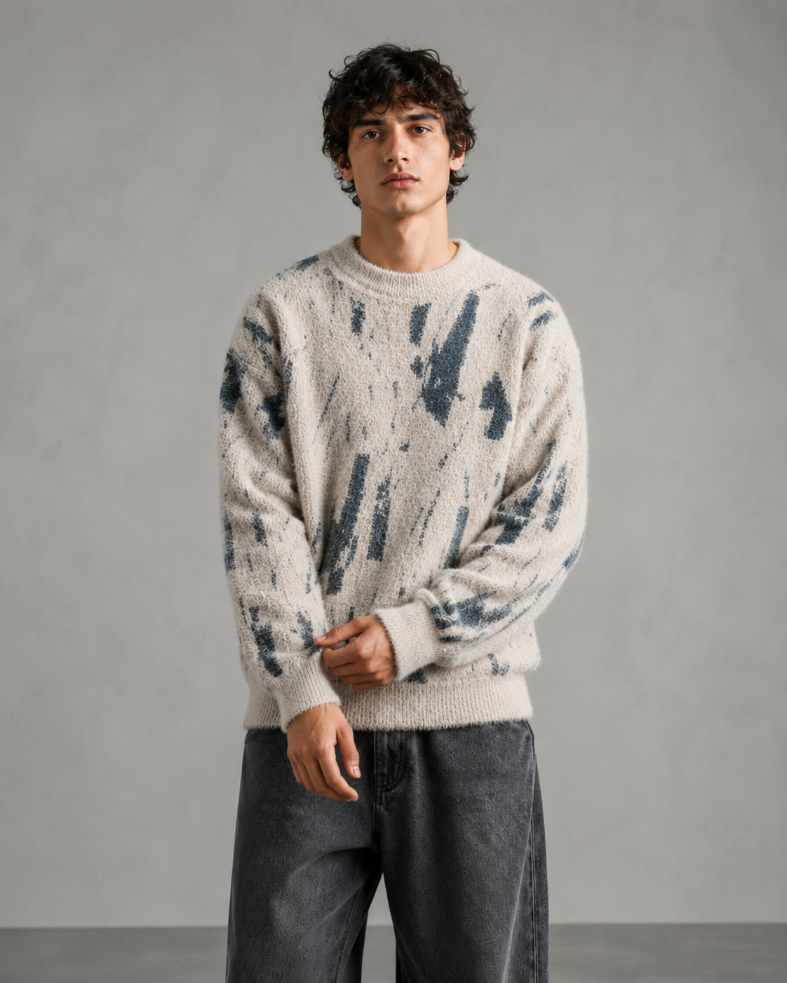 Relaxed-fit abstract knit sweater shown on a male model