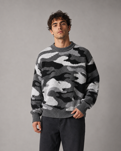 Side view of a men's camouflage sweater with a relaxed fit