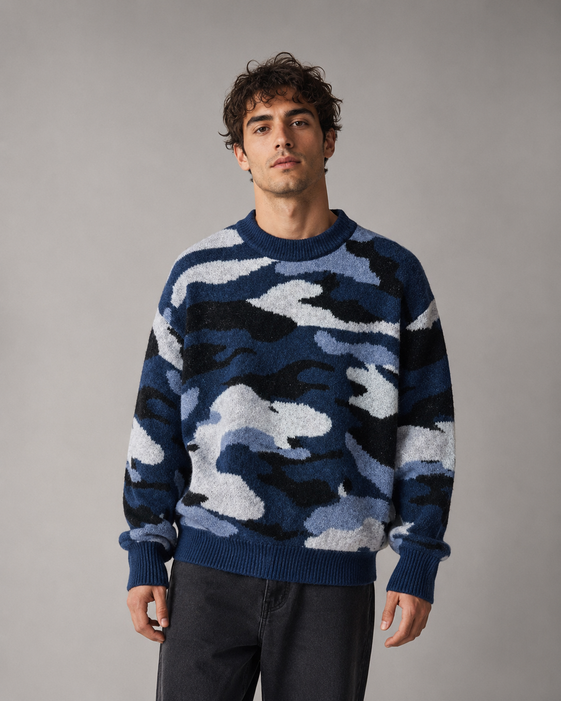 Men's camouflage knit sweater styled as an everyday casual outfit