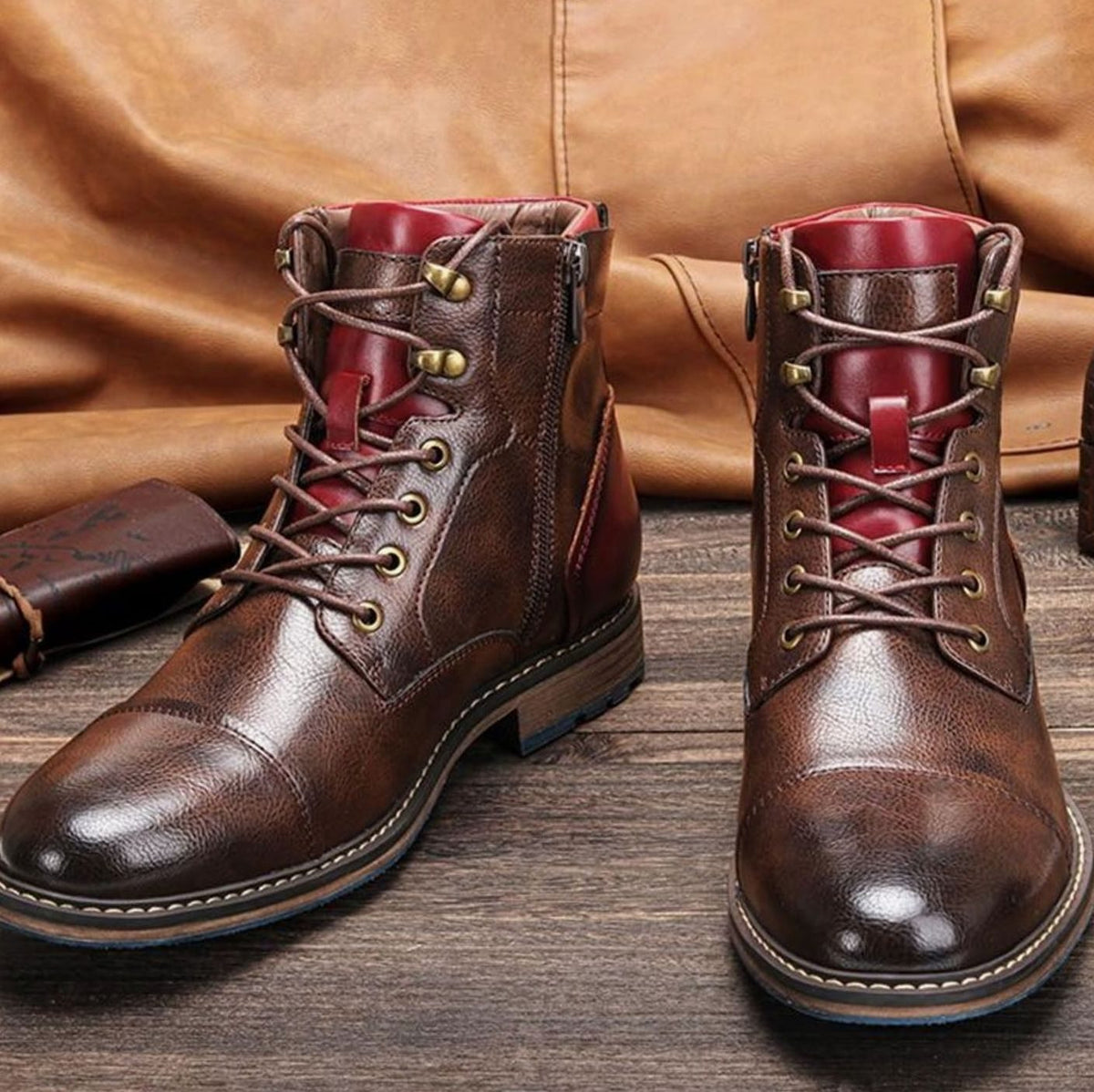 Pair of men's leather ankle boots featuring classic cap-toe detailing