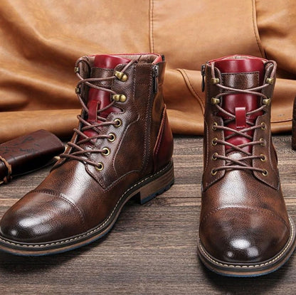 Pair of men's leather ankle boots featuring classic cap-toe detailing