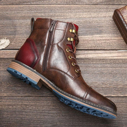 Men's cap-toe leather ankle boots shown from the side with a convenient zipper