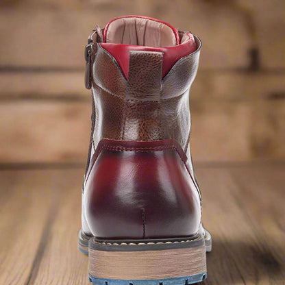 Front view of polished leather cap-toe ankle boots for men