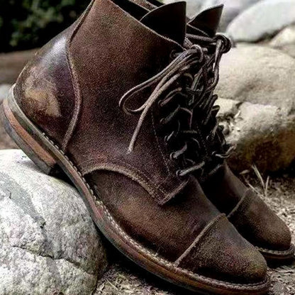 Pair of men's winter ankle boots with lace-up fronts and insulated lining