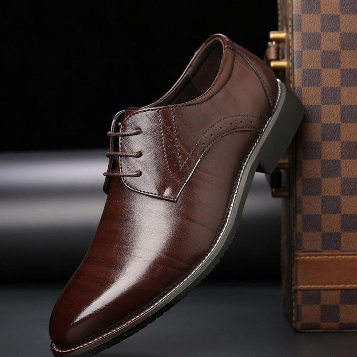 Men's polished leather brogue dress shoes shown from the side