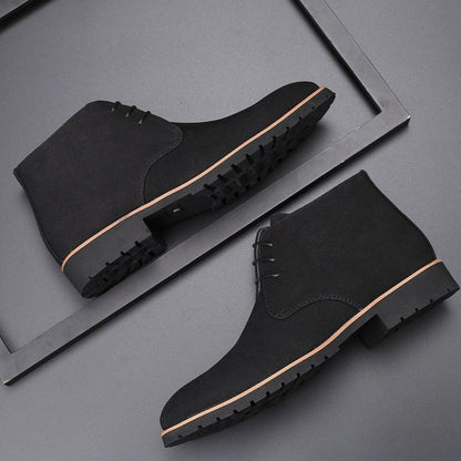 Men's suede chukka ankle boots shown from the side with lace-up fronts
